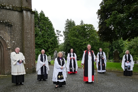 Bishop Michael Burrows and clergy with the Reverend Edna Wakely before the service of instition in St Mary's Castlecomer